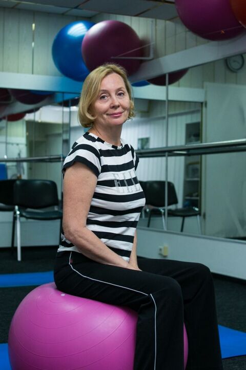 Woman with thoracic osteochondrosis after physical therapy